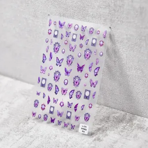 Detail view of thin flexible purple butterfly nail stickers with vintage frame designs