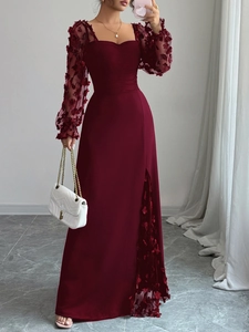 Détail de la robe longue bordeaux à manches brodées et fente latérale haute élégante