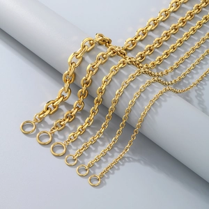 Detail of golden stainless steel chains in various sizes with round toggle ring clasps