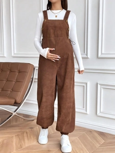 Detail of maternity corduroy overalls with adjustable straps and large front pockets
