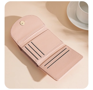 Detail view of pink PU leather wallet interior showing multiple card slots and magnetic snap