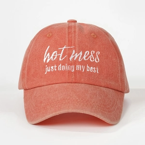 Coral orange washed cotton baseball cap featuring Hot Mess embroidery and vintage style