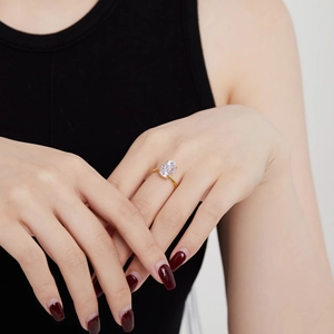 Close-up of S925 sterling silver ring featuring an oval cut zircon on a gold band