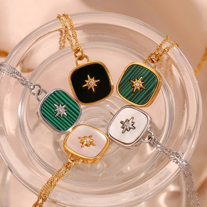 Macro view of square starburst necklaces with colorful shell inlays and zircon details