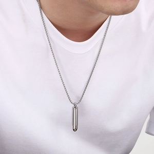 Minimalist stainless steel bullet pendant necklace on model with classic box chain