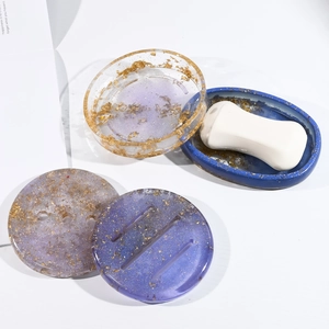 Handmade gold foil resin soap dish molds featuring oval and round drainage designs