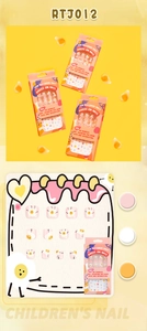Macro detail of RTJ012 cute fried egg theme press-on nails for kids in bright orange box