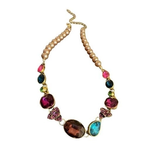 Vintage style necklace with colorful gemstones and pearl beads on a gold-plated base