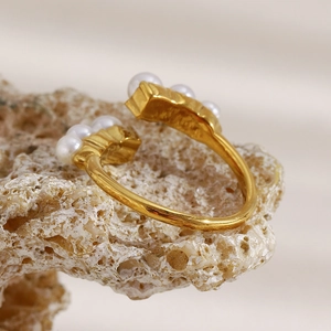 Retro 18K gold plated stainless steel open ring with pearls on a textured rock base