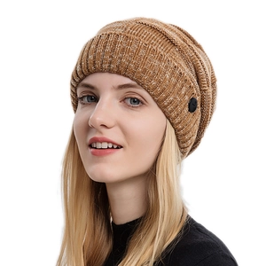 Winter chunky knit beanie in dark caramel with side button detail on female model