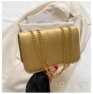 Detailed view of the vertical stripe texture and golden metal chain on a PU leather bag