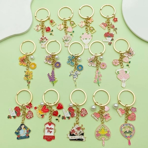 Detailed macro view of Mother's Day enamel charms with gold plating and pearl accents