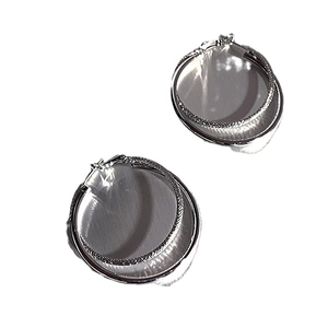 Elegant silver double-layer hoop earrings with textured inner ring and smooth finish