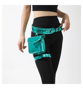 Teal metallic mini waist and leg bag worn by a model over black athletic leggings