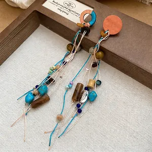 Bohemian ethnic drop earrings with turquoise beads, wood elements and leaf charms