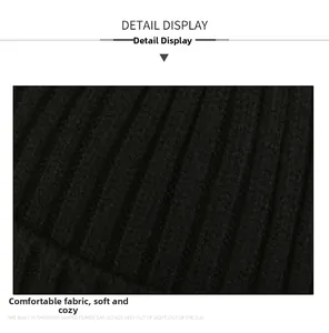 Macro shot of black ribbed knit fabric detail showing soft texture of winter beanie