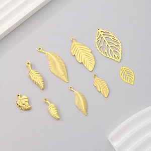Nine assorted gold plated stainless steel hollow leaf pendants for jewelry making