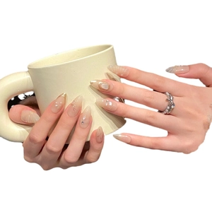 French luxury nude cat eye press-on nails with 3D gold edges, pearls and crystals