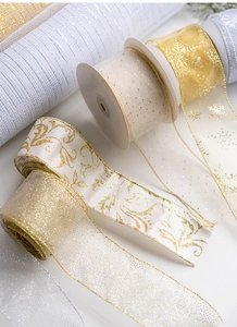 Detail of white and gold Christmas ribbons with glitter dots and snowflake patterns