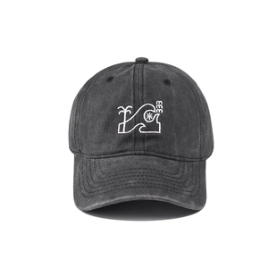Detailed view of dark grey washed cotton baseball cap with coconut tree embroidery