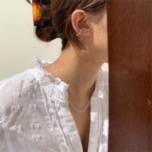 Minimalist 925 sterling silver chain necklace and earrings on a model in French style