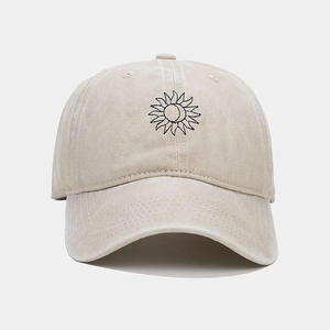 Vintage washed beige cotton baseball cap with black sun embroidery and curved brim