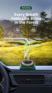 Solar powered car aromatherapy diffuser in dark green finish on dashboard with forest view