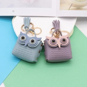 Handcrafted owl leather keychain with tassels in purple and blue faux leather