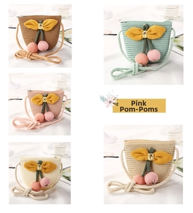 Detail of cute straw woven bucket bags with 3D bows and pink pom-poms in five colors