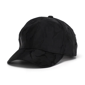 Detail shot of black camo baseball cap with structured six-panel crown and curved brim