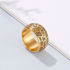 Macro detail of men's vintage gold ring showing unique embossed texture and inner band