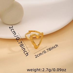 Detail view of a 2cm gold heart ring with hammered texture and adjustable open band