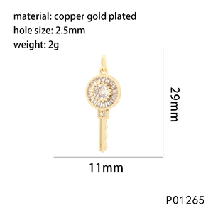 Detailed view of a gold-plated copper key pendant with 29mm x 11mm dimensions for DIY jewelry