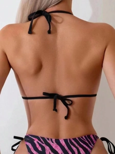 Rear view of tie-side bikini bottoms featuring pink and black zebra print patterns