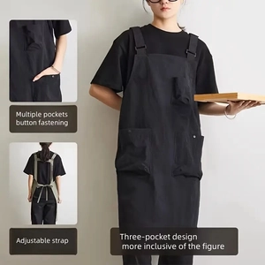 Waterproof black utility apron with adjustable straps and multi-pocket functional design
