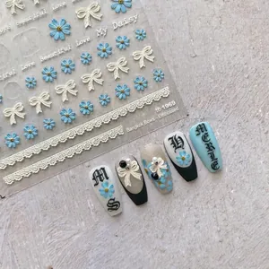 3D embossed nail stickers featuring blue daisies, lace bows and vintage butterfly patterns
