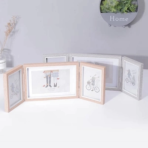 Detailed view of triple folding wooden photo frames in natural wood and grey wood grain finishes
