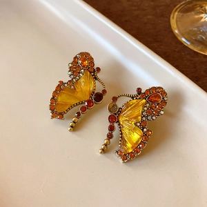 Vintage butterfly stud earrings with sparkling crystals in a golden retro jewelry set