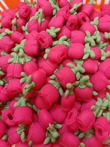Rose shaped silicone cable protector beads in bulk storage for phone charging lines