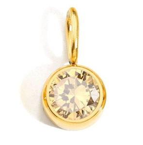 Detail of round cut yellow birthstone pendant in gold plated stainless steel bezel