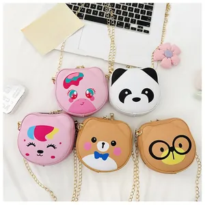 Detailed view of five colorful cartoon animal crossbody bags with gold metal chain straps
