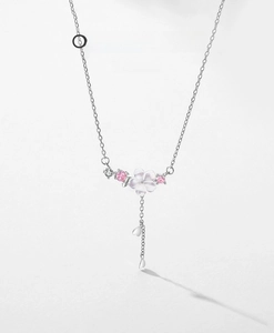Detail of S925 silver floral necklace with pink shell flower and heart charms