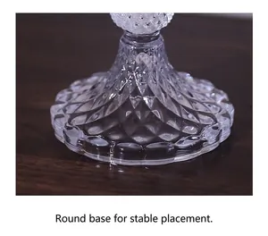 Detail of clear crystal glass candle holder base with stable round diamond texture