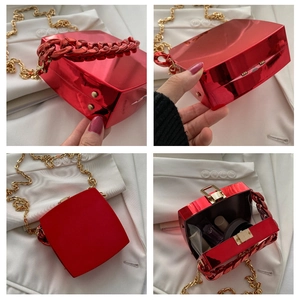 Red geometric hard shell mini bag with gold and red chain straps in multi-angle view