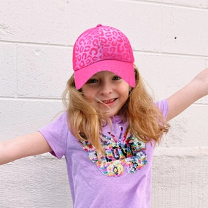Pink leopard print kids baseball hat shown on model with sun protection brim