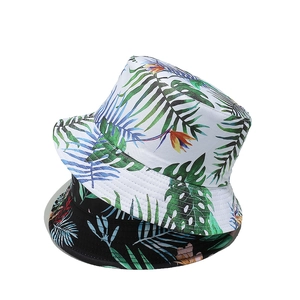 Tropical banana leaf print bucket hats in black and white for summer sun protection