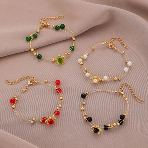 Conjunto de pulseras retro con cuentas y dijes de flores en cuatro colores únicos