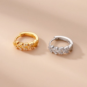 Leaf-shaped zircon-inlaid earrings in gold and silver finish, elegant jewelry piece