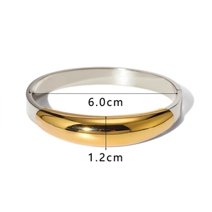 Detailed size specifications for a two-tone polished stainless steel wide cuff bracelet