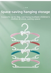 Detail of retractable kids hangers showing bow design and vertical stacking hook feature